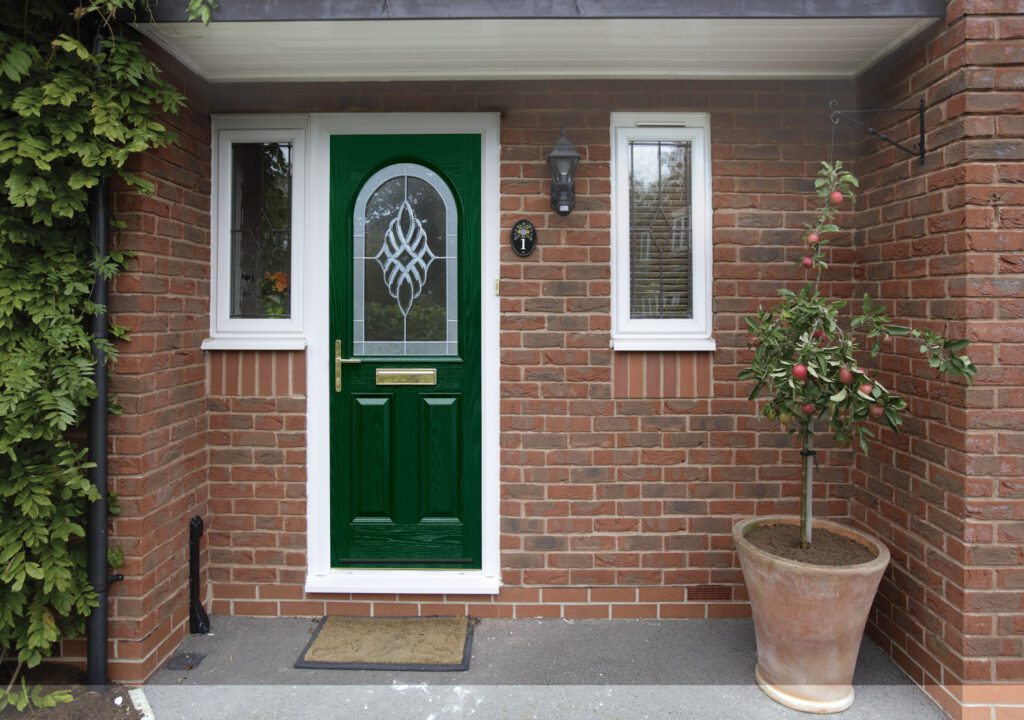 GFD Homes front door: Entrance of a home with a green composite door installed. 