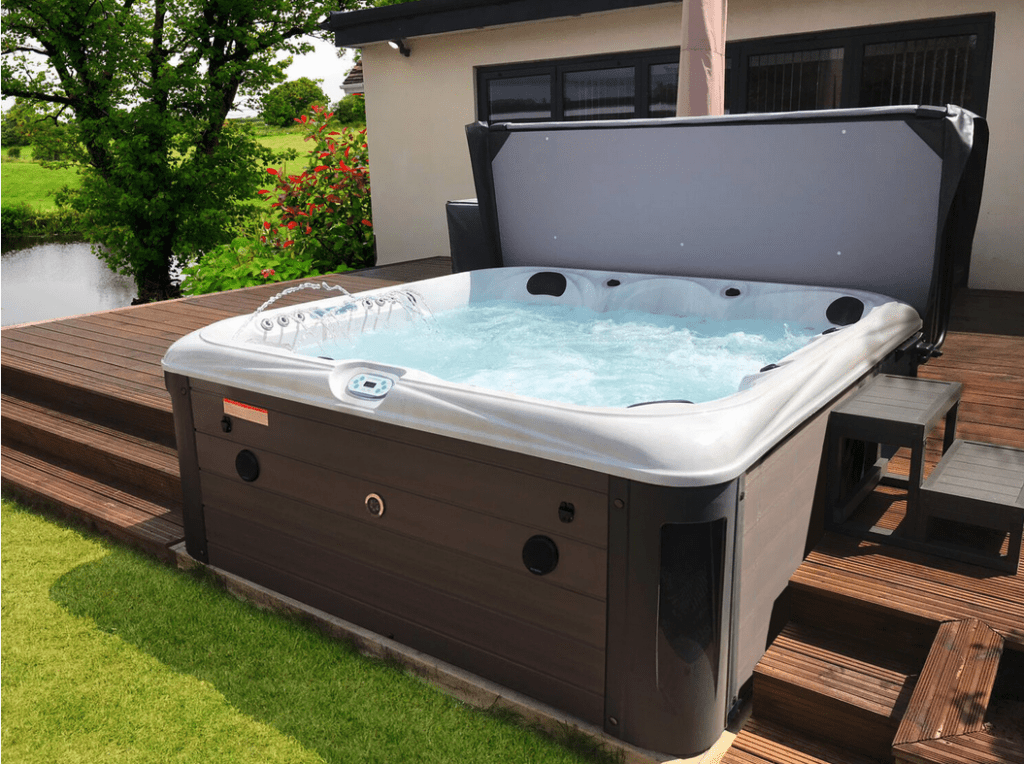 GFD Homes square hot tub: Hot tub installed in a back garden with decking. 