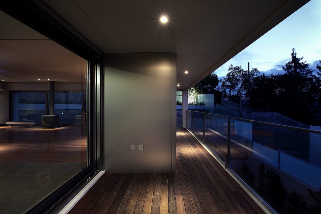 GFD Homes sliding patio doors: sliding doors installed on a home with a balcony view, sunset view. 