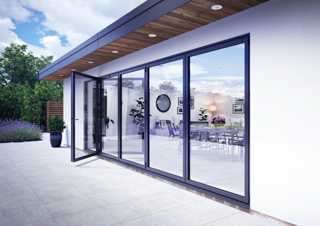 GFD Homes folding door: Side view of home with a bifold door installed and the traffic door open. 