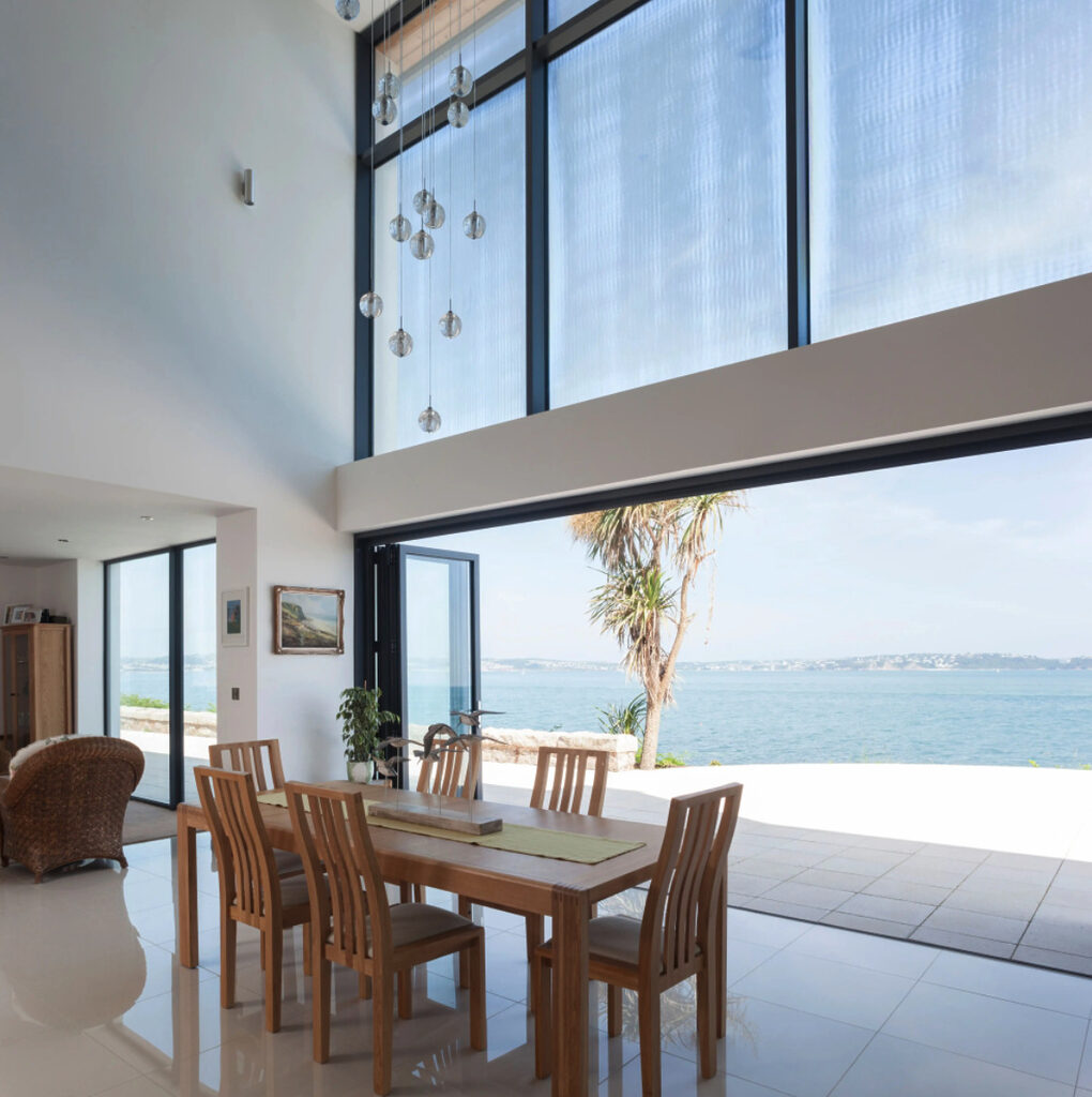 GFD Homes Bifold door fully opened to blurr the lines between the outside and inside. 