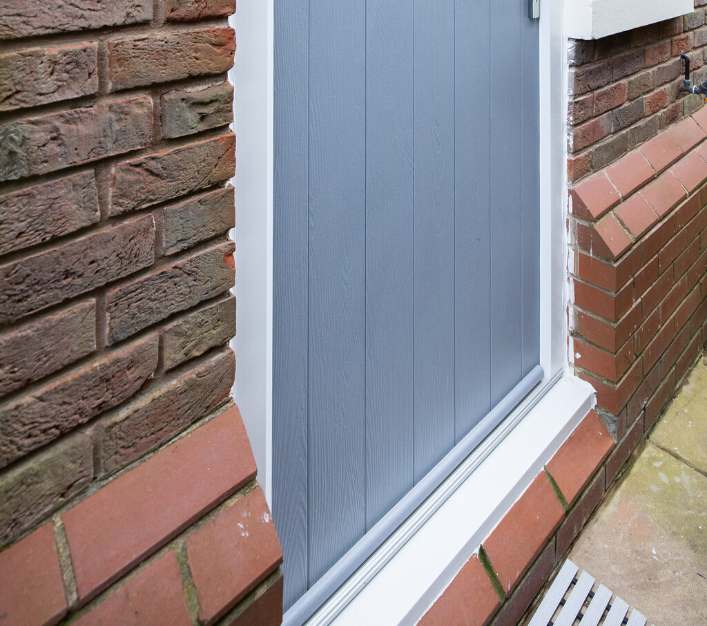 GFD Homes Are Composite Doors Fire Rated: Blue composite door with sill. 