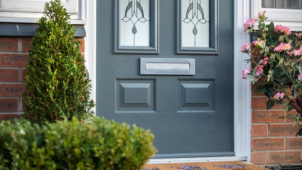 GFD Homes Exterior door: New Solidor exterior door colour, Granite Grey displayed as part of a front entrance.