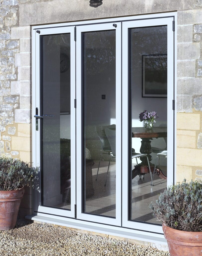 GFD Homes How much are bifold doors: 3 Panel Smart Bifold door in white on rear of property facing garden.