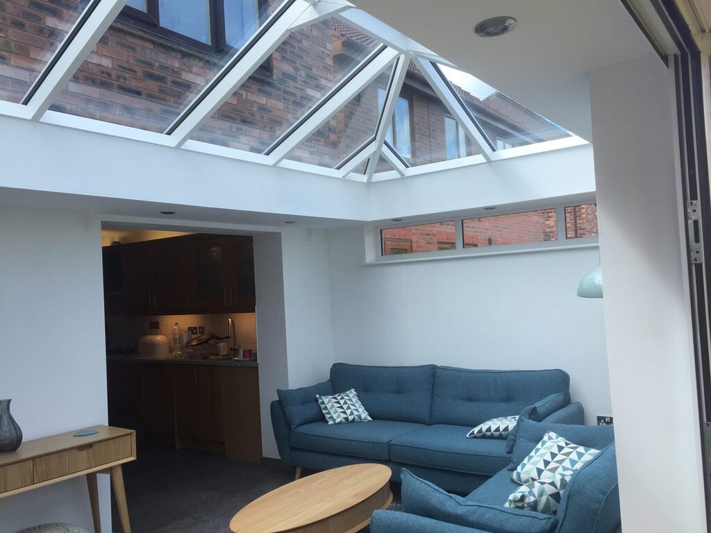 GFD Homes Large roof lantern installed in ceiling of living area. 