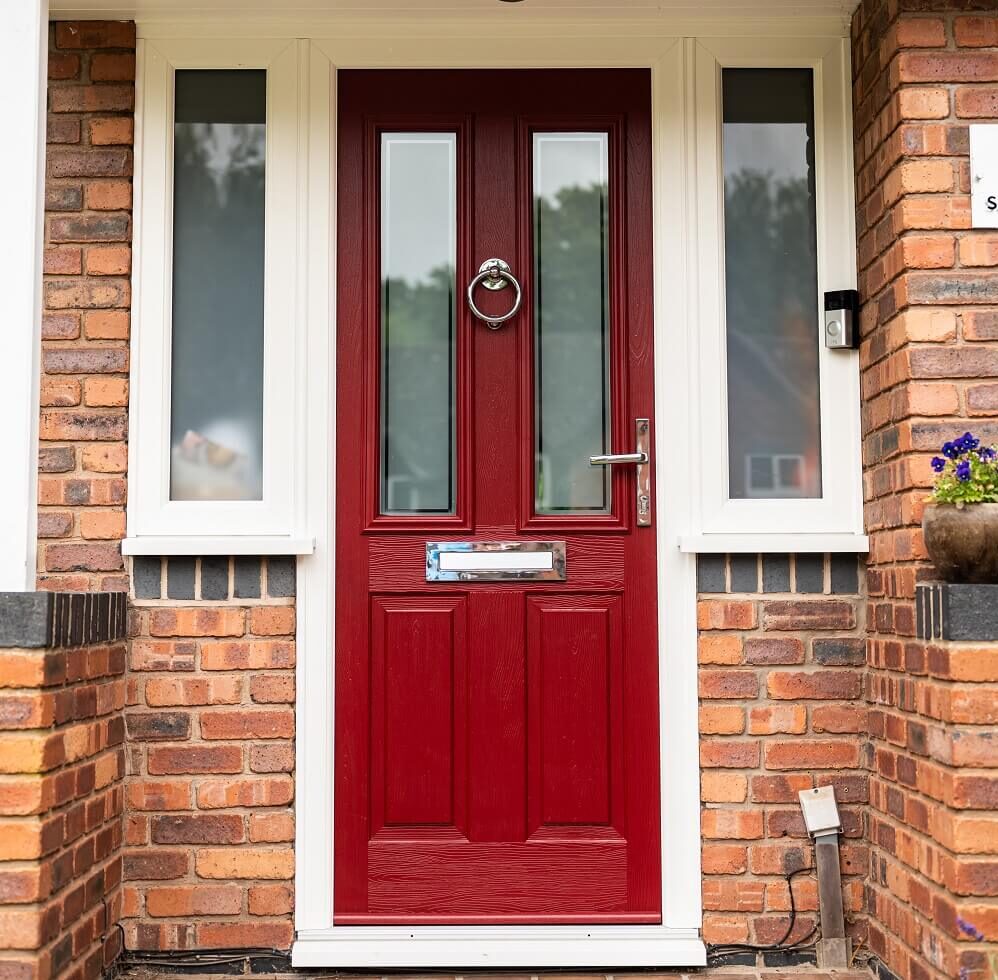 GFD Homes Door sill: Comp Door Whitmore composite door in red, installed in the entrance of a home. 