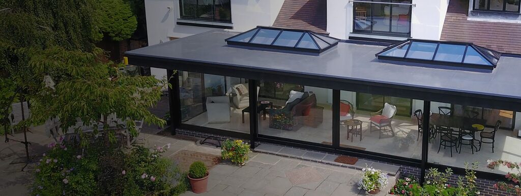 GFD Homes 2 Roof lanterns installed on a large roof with furniture in sight. 