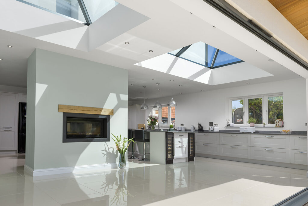 GFD Homes Interior view of a kitchen extension with two korniche roof lanterns in the ceiling