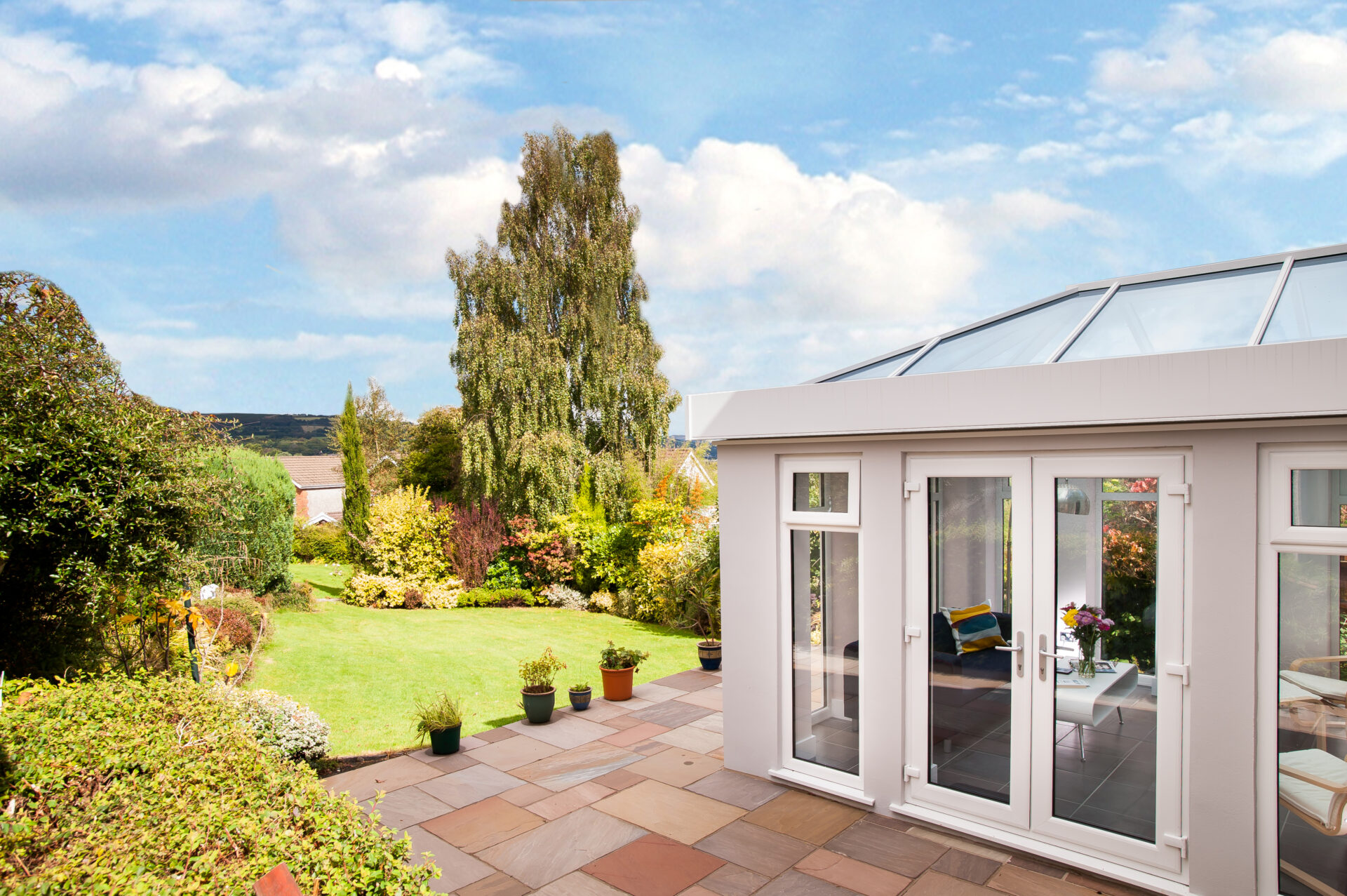 GFD Homes roof lantern extension looking out onto a well kept garden