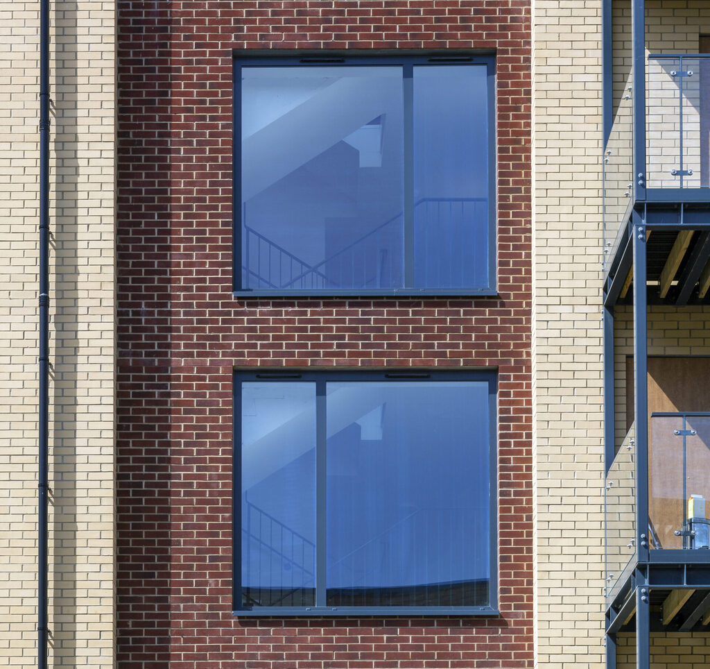 aluminium window frames: clean and sleek aluminium window frames really make this block of flats pop off
