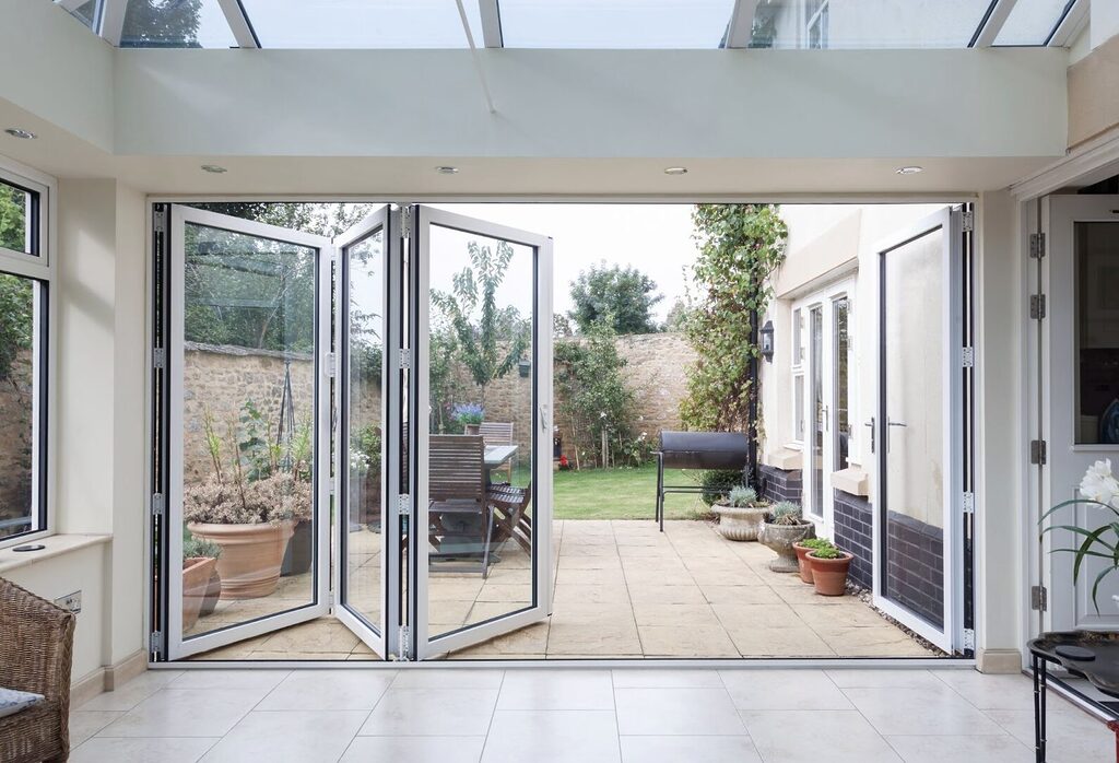 GFD Homes What is a bifold door? This is a bifold door open and leading out onto a patio