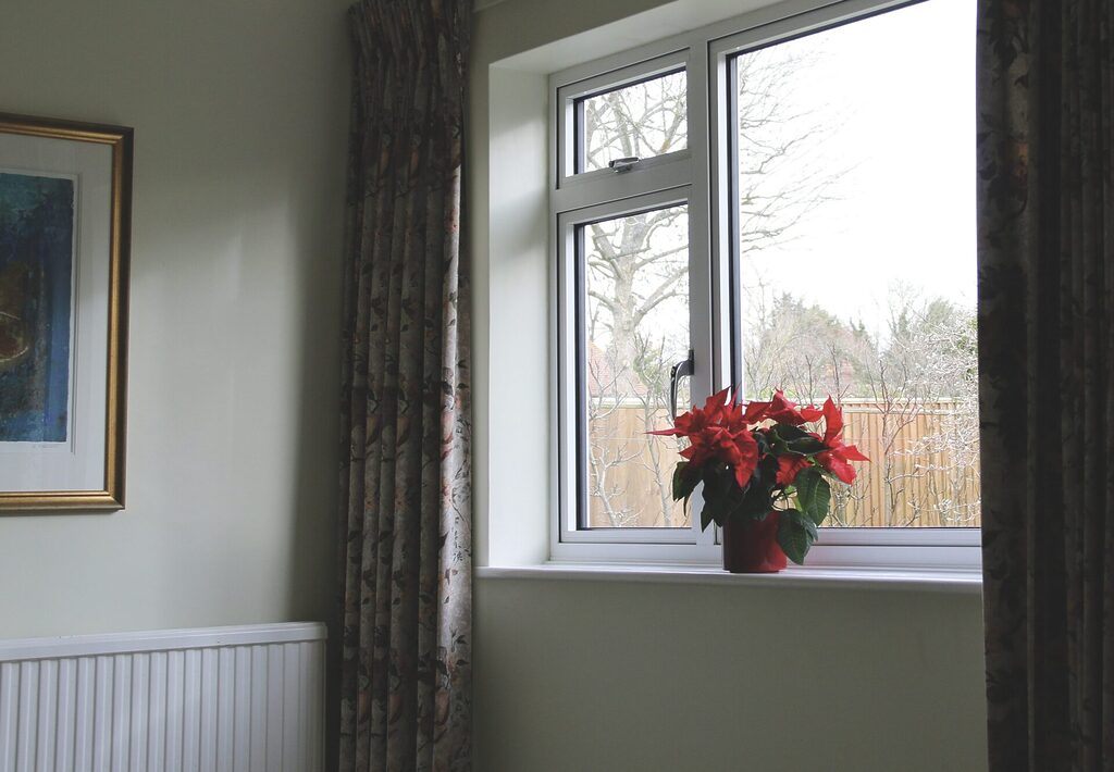 GFD Homes aluminium frame windows: interior shot of an aluminium framed window in white 