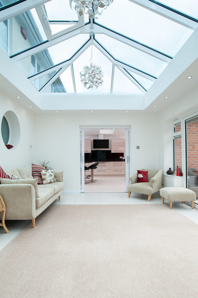 GFD Homes Atlas roof lantern: Large Atlas roof lantern installed above living room, with spotlights surrounding the roof lantern. 