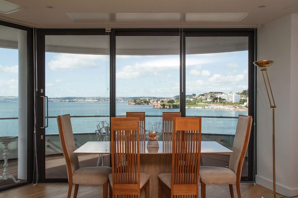 GFD Homes how do you adjust a sliding glass door: Sliding doors installed as living room external door with sea views. 