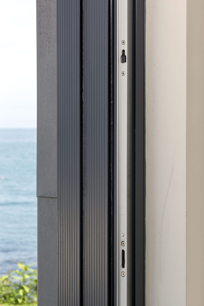 GFD Homes aluminium sliding doors prices: close up shot of the frame of a very well prices aluminium sliding door 