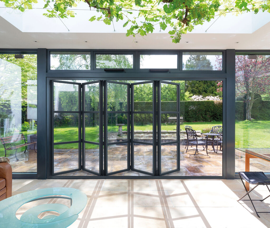 GFD Homes how to clean bifold doors : looking out of shint clean bifold doors into a weel kept garden and patio