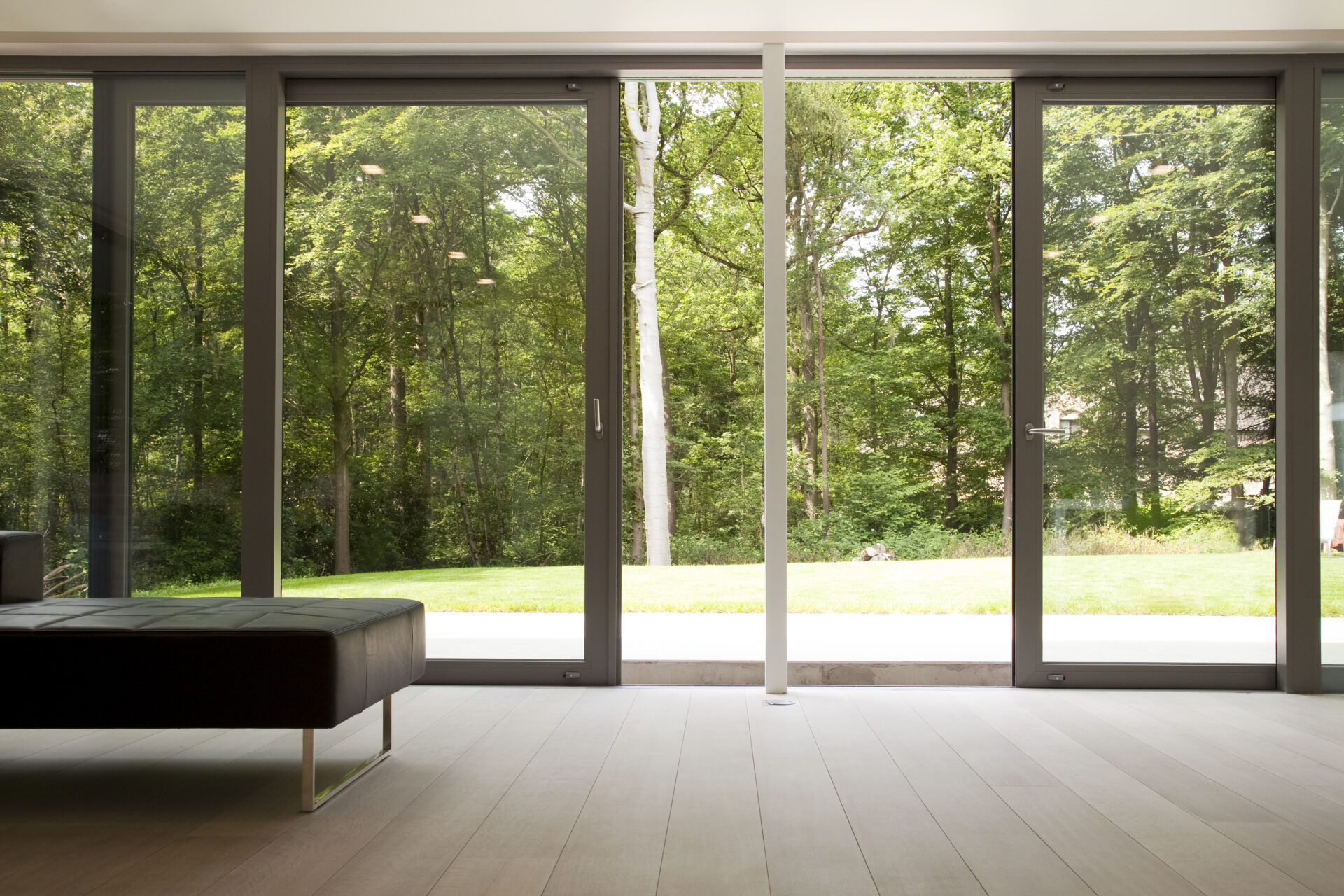 GFD Homes double glazing cost : a sliding door opening out into a spacious and green garden 