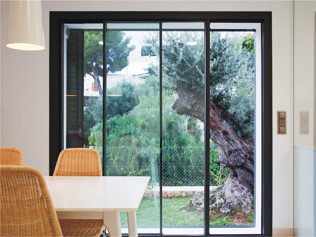 GFD Homes front doors : Cortizo sliding door installed in dining room with garden in view. 