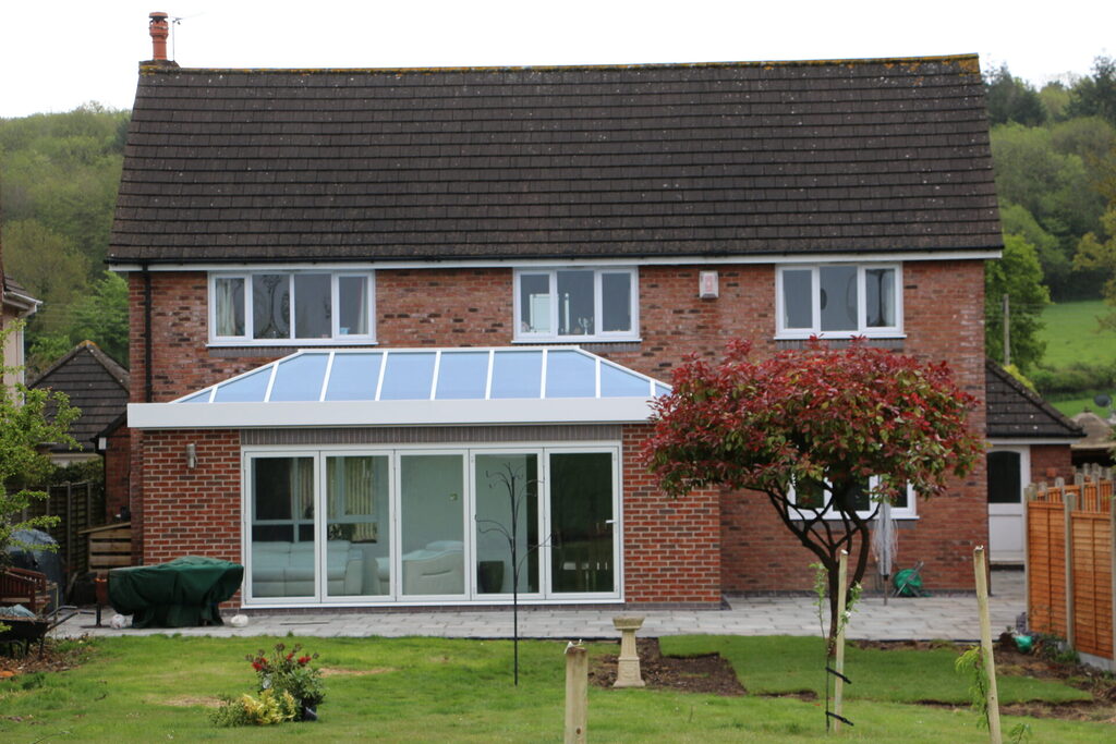 GFD Homes roof lantern repairs  : looking at a large well maintained roof lanterns in a well kept garden and home