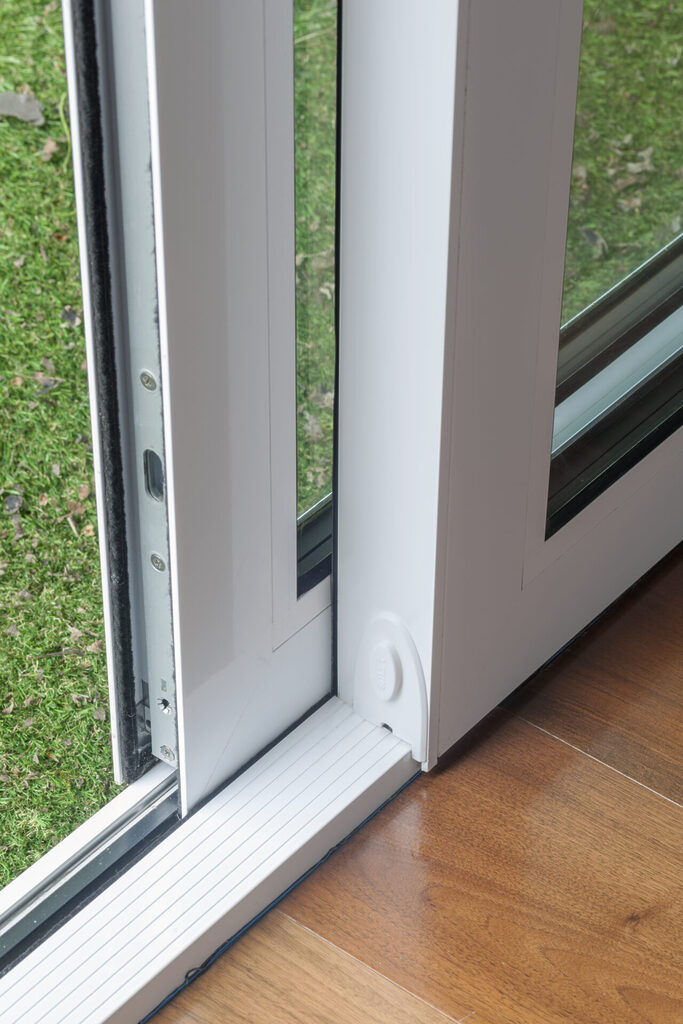 GFD Homes how to adjust rollers on sliding doors :   Sliding door track zoomed in. 