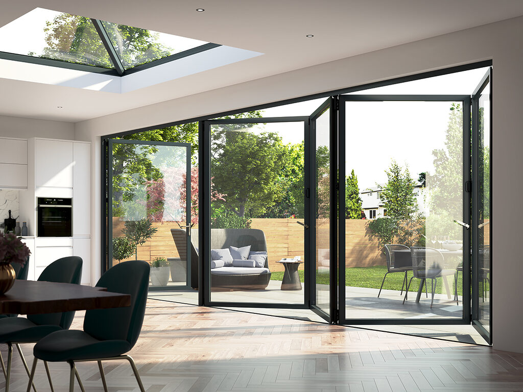 GFD Homes Door : korniche bifold doors from inside an extnesion looking out onto a patio