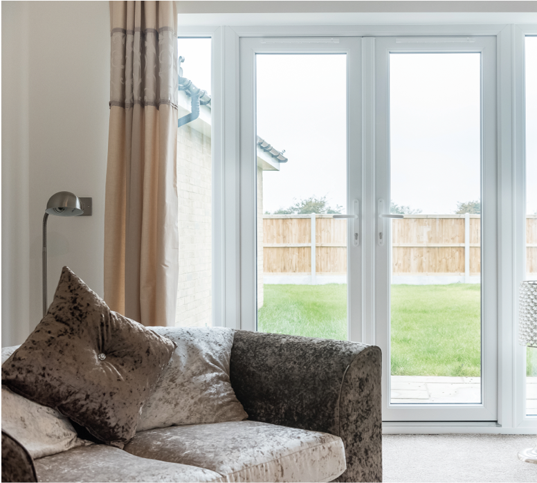 GFD Homes french door installation : looking out to a garden through uPVC french doors 