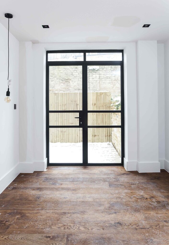 GFD Homes changing a door: french industrial style doors with garden view in background