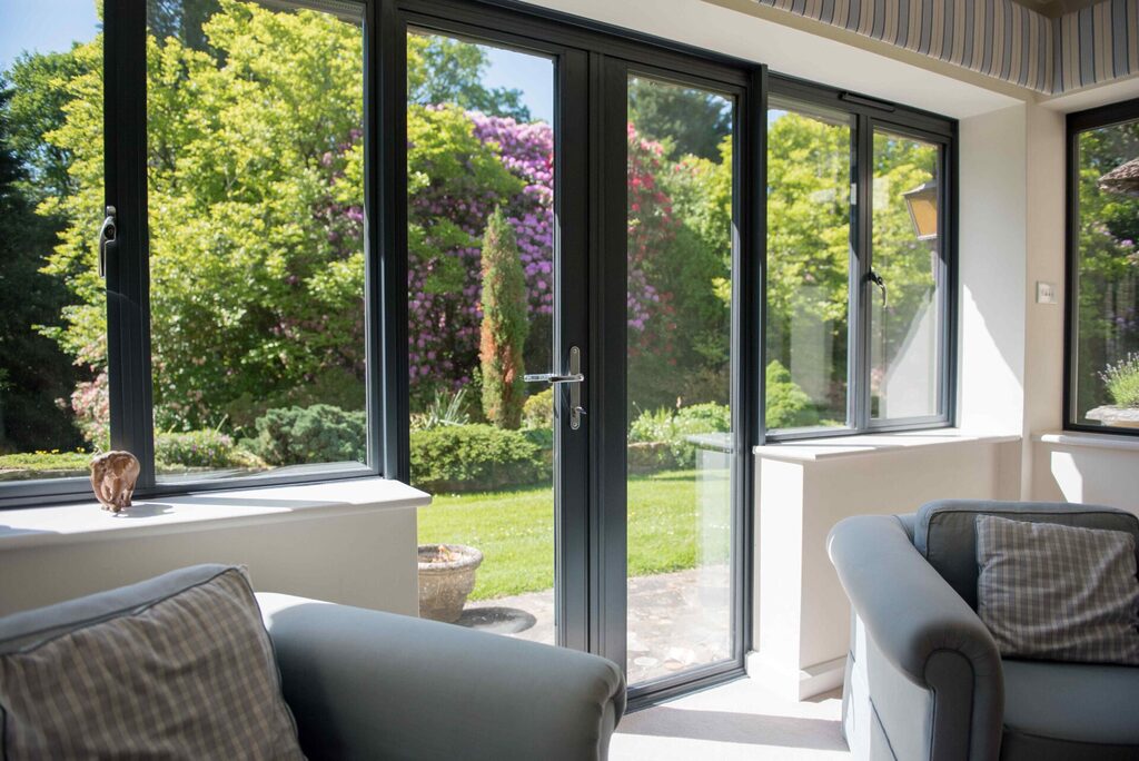 GFD Homes french door installation : looking out into a garden from inside an extensions 