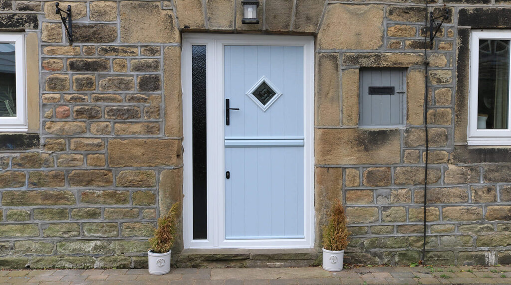 GFD Homes Stable Doors : light blue stable door against a stonewall 