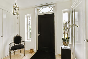 black door in entrance of home