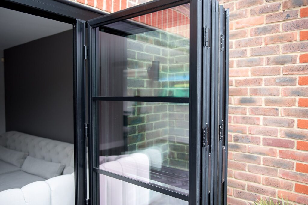 GFD Homes Bifold Doors: Bifold door folded back like an accordion. 