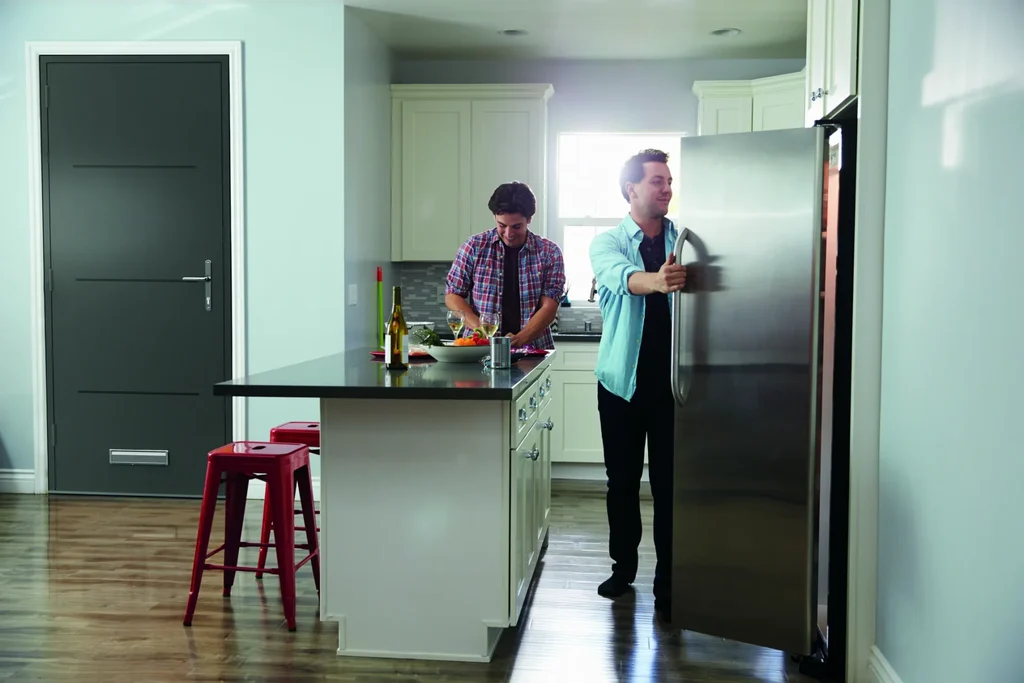 GFD Homes aluminium composite doors: people in kitchen with door behind