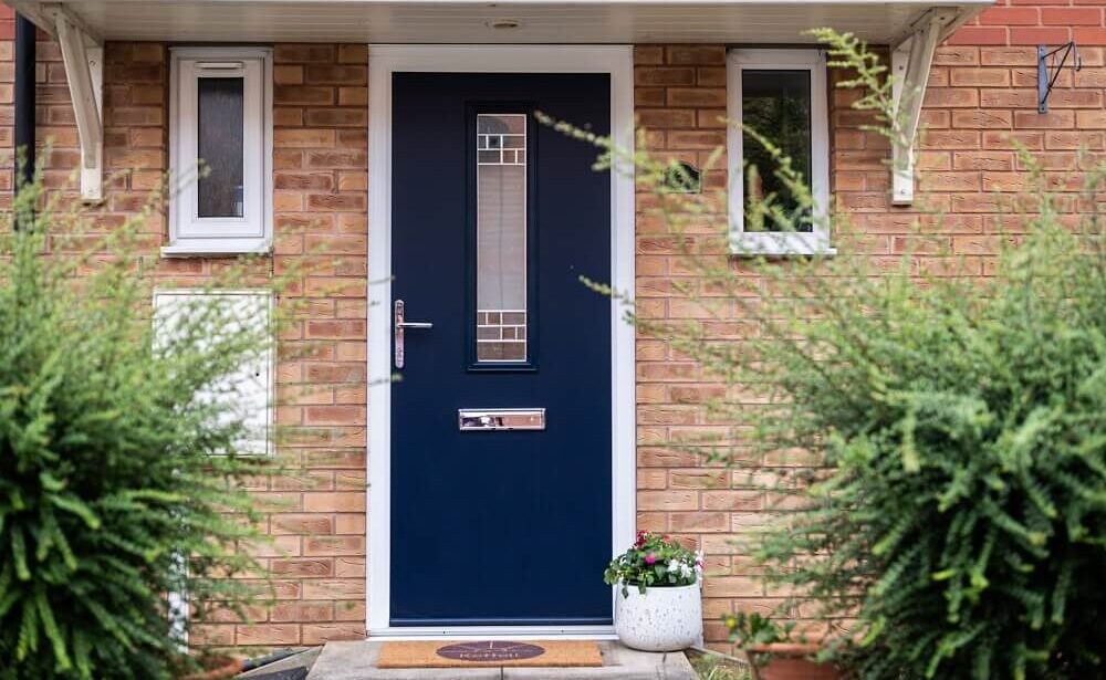 Composite Door Prices : com door with a decorative window in a traditional configuration