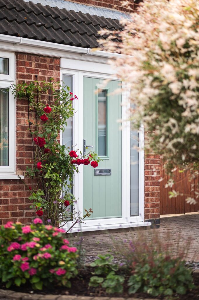 Entrance Doors : mint composite entrance door surrounded by greenary 