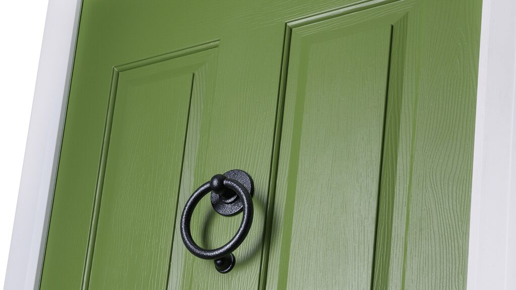 front doors uk: Solidor forest green door zoomed in to show door knocker. 