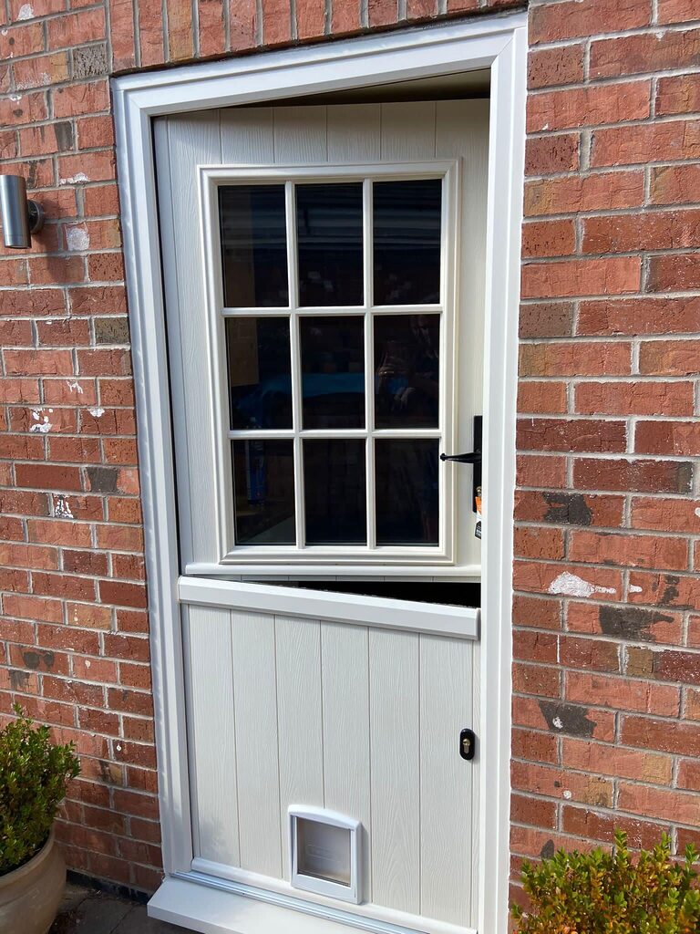 front door: solidor stable door half open with a cat flap. 