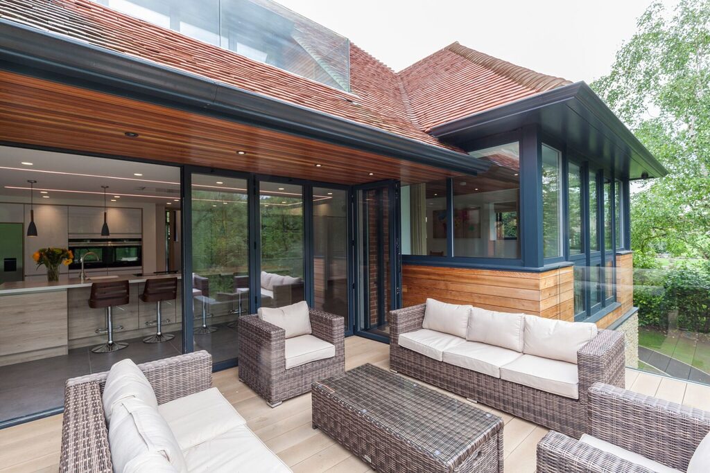 Smart Bifold Doors :  lovely patio area with open smart bifold doors