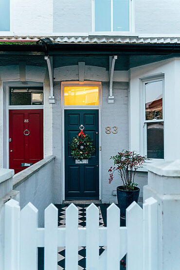 composite front doors: front view of home with wreath on