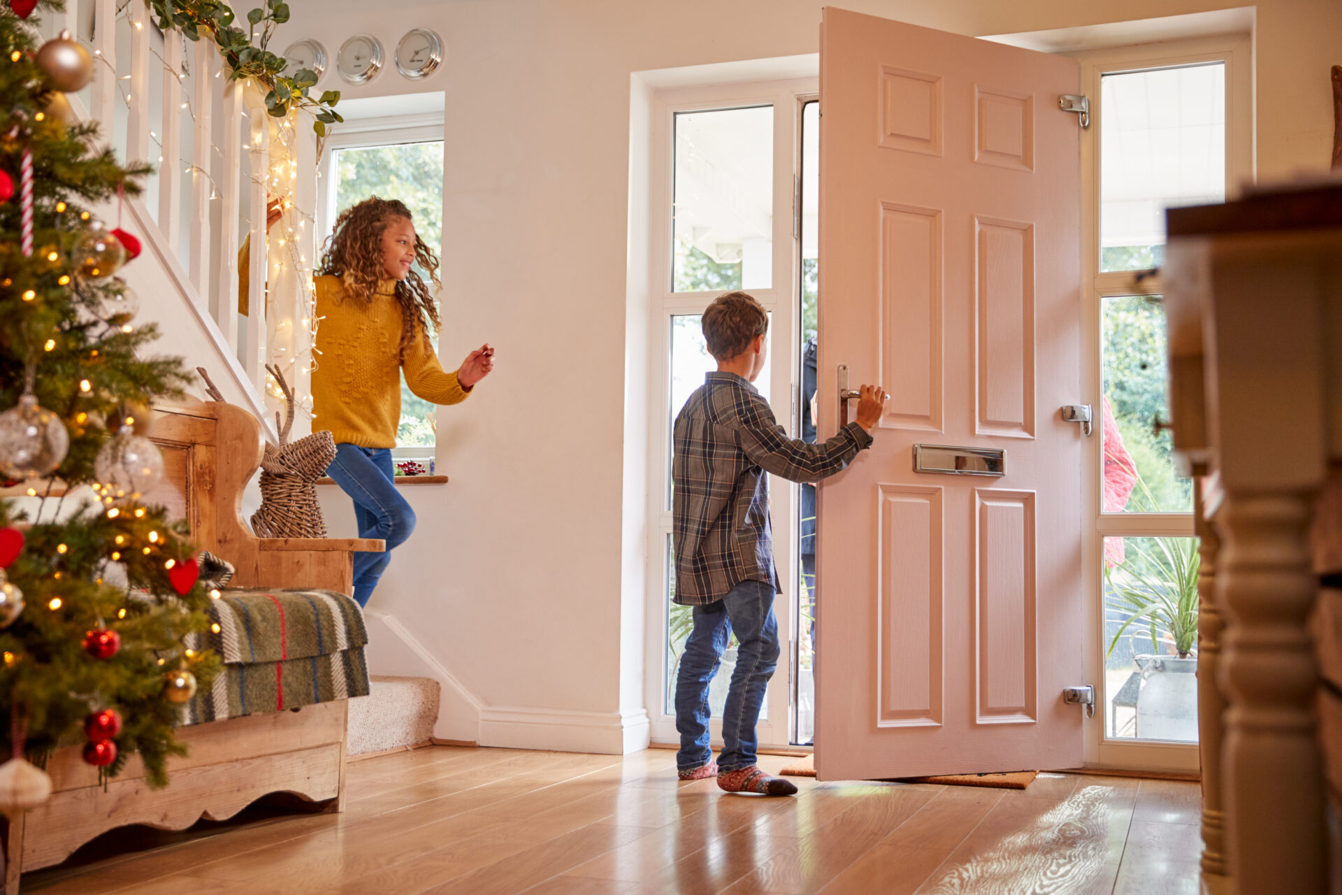 GFD Homes composite front doors: kid opening door halfway